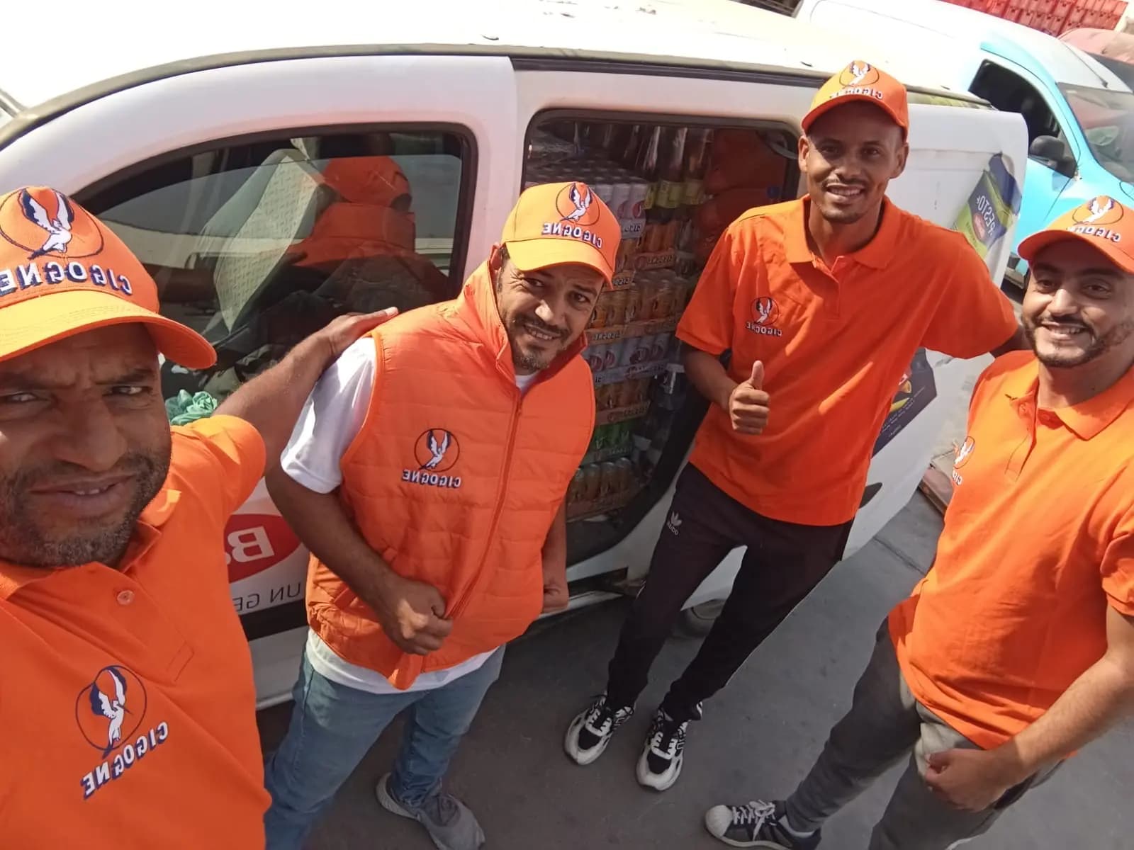 Sales Uplift distribution team beside a branded delivery vehicle