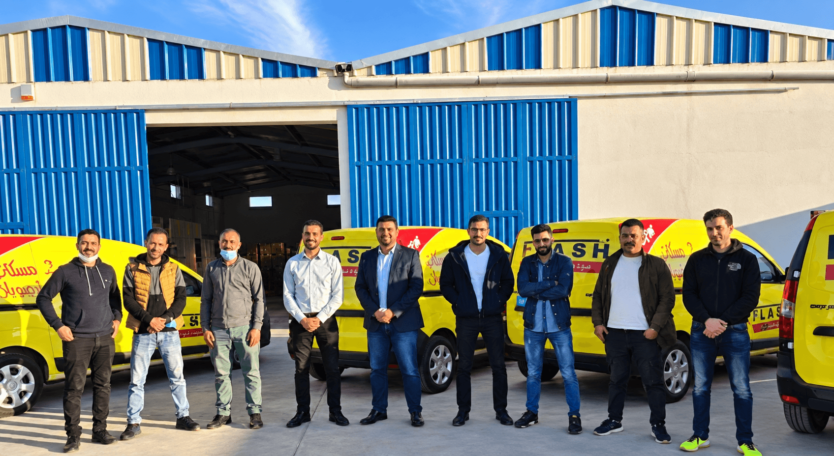 Sales Uplift team in front of the Tamesna warehouse and distribution fleet