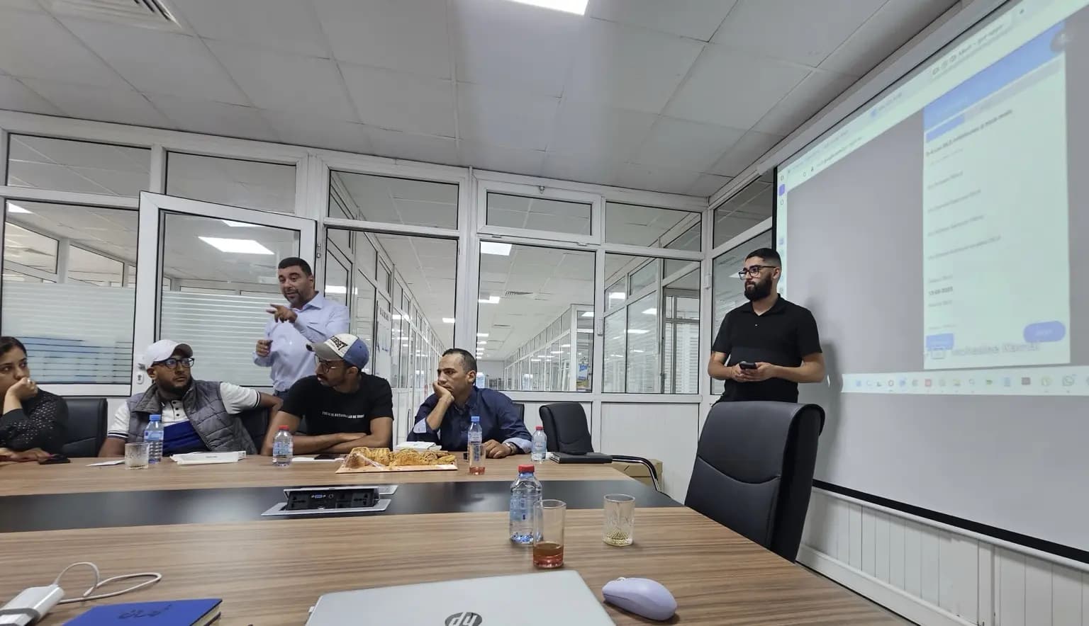 Al Karama team reviewing 1Channel